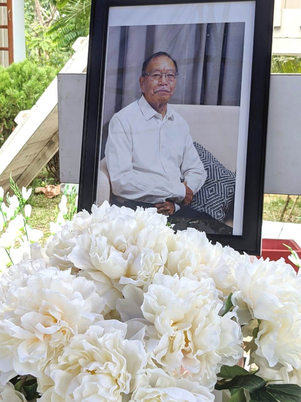 A photograph of Dr PS Lorin, who passed away on May 31, rests above his coffin during the funeral service.